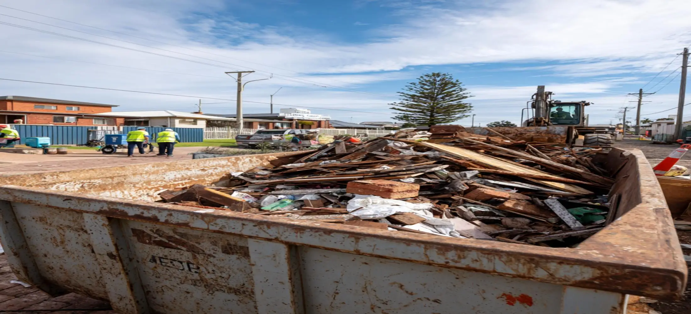 Commercial skip bin containing construction materials, garden waste and household rubbish for skip bins hire Bunbury services
